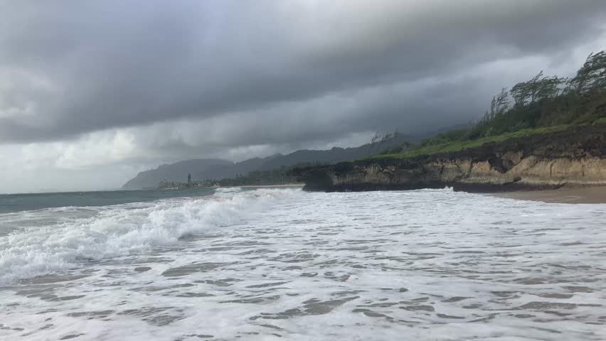 Waves crashing on the beach on the north shore of Oahu Hawaii after a storm