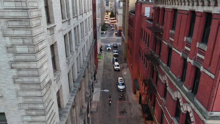 An alleyway between two buildings in the heart of the city.