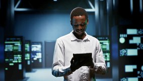African American engineer supports AI computing in a data center, connecting artificial intelligence, machine learning workloads and large scale data processing during checkup server room. - Powered by Shutterstock - Get 15% off with code: PIKWIZARD15