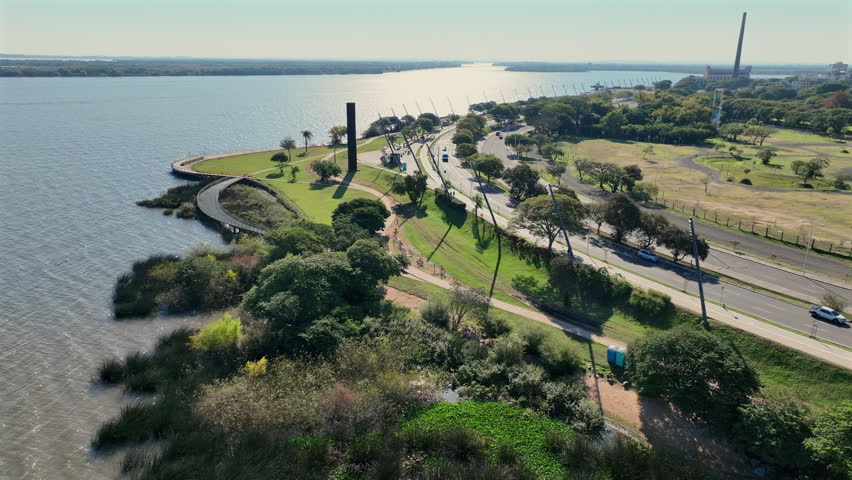 Porto Alegre waterfront curved riverside walkway with city skyline and Rio Guaíba