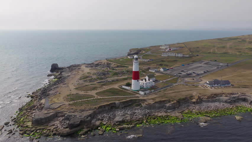Aerial drone view of Portland Bill Lighthouse on the Isle of Portland in Dorset, England, overlooking the Jurassic Coast and the English Channel