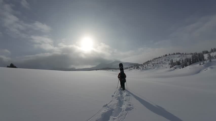Snowshoer Walking Through Deep Snow Near Sunshine Village Banff Canada