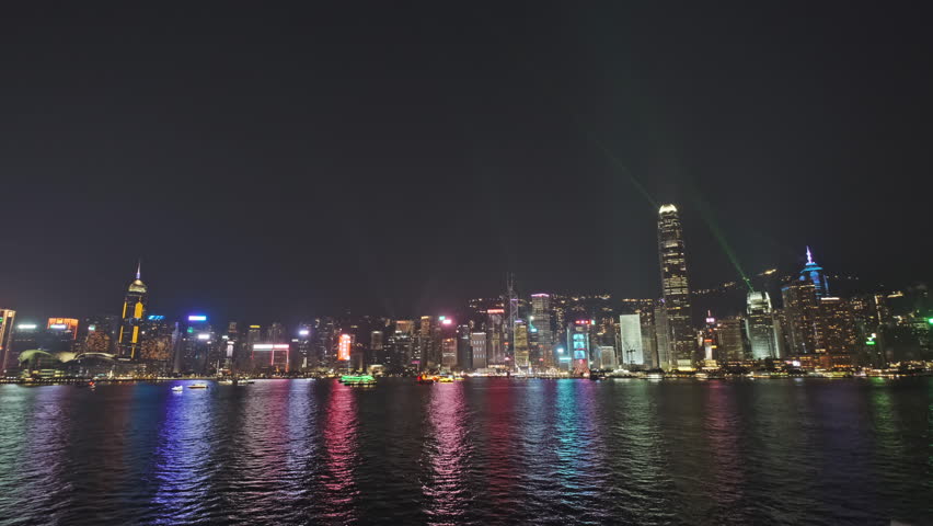 Light show in Hong Kong at night. Victoria Harbour and Hong Kong Central, 4k