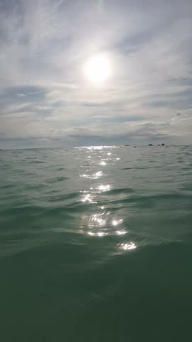 Sun Shining Over Rippling Ocean Waves