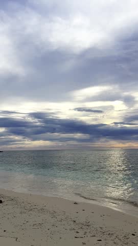 Beach Shoreline Under Cloudy Sky