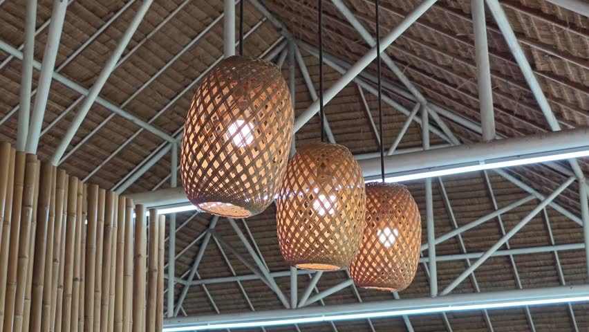 Hanging lamp with traditional woven bamboo cover. 