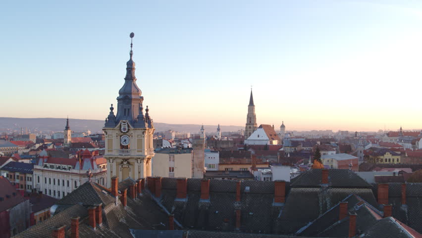Wide aerial shot panning across the historic Cluj-Napoca skyline in Romania, St. Michael