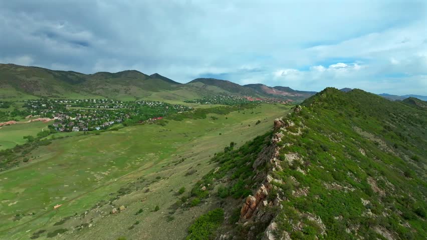 Ken Caryl Valley Ranch Hogback Ridge summer morning blue sky Meadow Ranch Littleton South Valley entrance Denver Colorado aerial drone Front Range Rocky Mountains foothills circle right motion