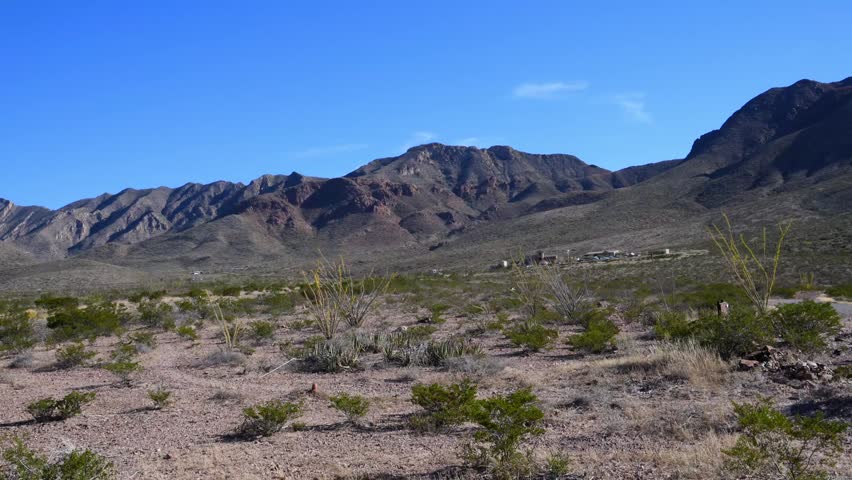 Texas, USA – November 14, 2025: landscape of the Franklin Mountains in El Paso, Texas, characterized by rugged igneous rock formations. This area is part of Franklin Mountains State Park, which offers hiking opportunities, including the popular North Franklin Mountain Trail. Desert vegetation is visible, including ocotillo (Fouquieria splendens), against the backdrop of an arid mountainous landscape.