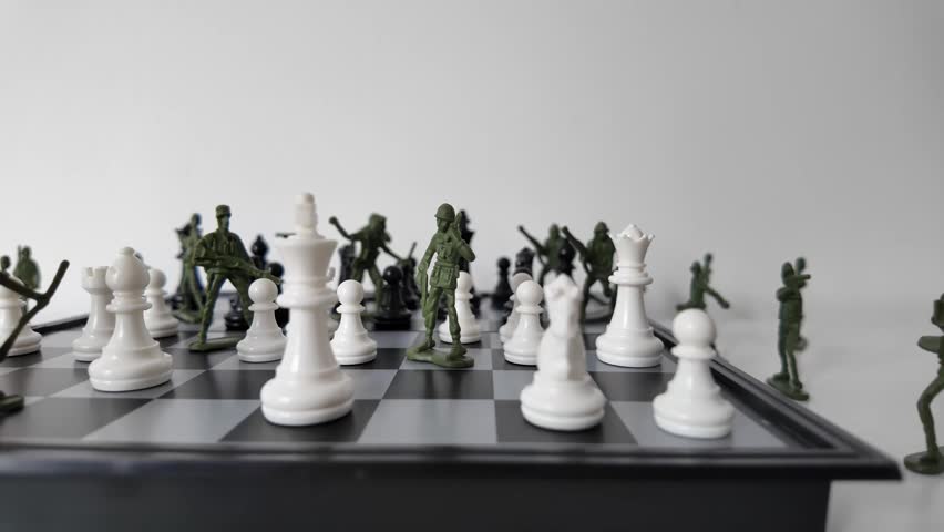 Chess Pieces Facing Toy Soldiers on Strategy Board
