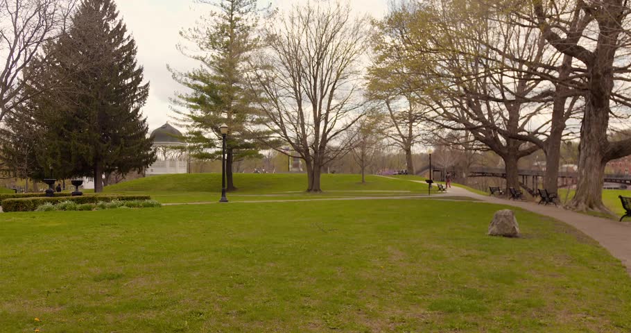 Wide view of Grant Park lawn with trees, walking paths, benches, and pavilion