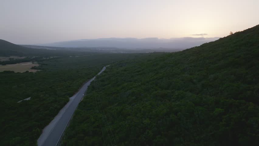 A road towards horizon with clouds
