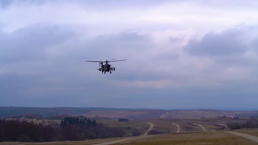 AH-64 Apache Helicopter During Military Training Exercise