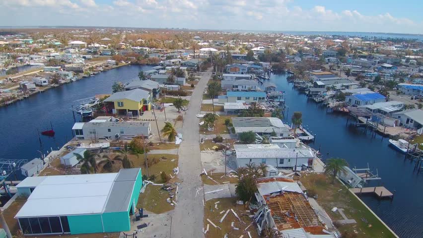 Severely Damaged Homes After Hurricane Ian in Florida Residential Neighborhood
