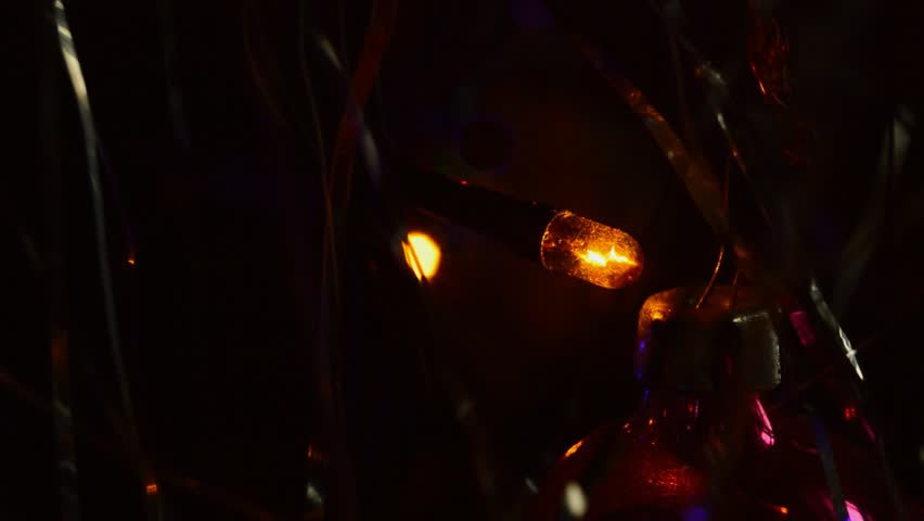 Christmas lights on artificial tree close-up