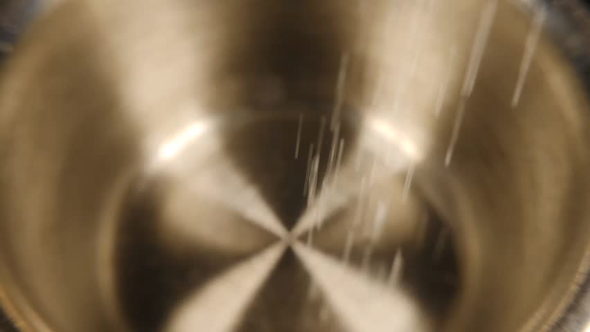 Extreme close-up, Demonstration of the stages of brewing ground coffee in a stainless steel cup