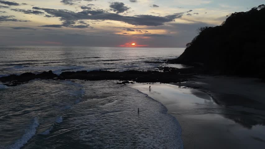 sunset on cloudy day on. beach in costa rica 