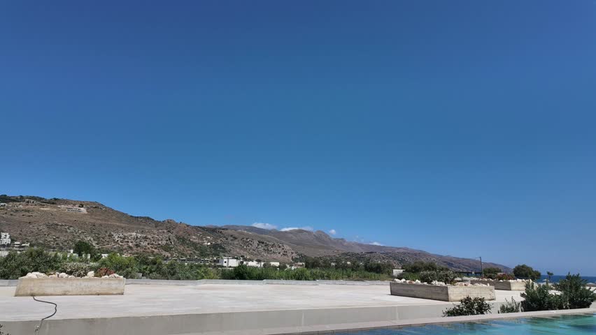 Beautiful view of mountain landscape near hotel during sunny time lapse on Crete. Greece. 