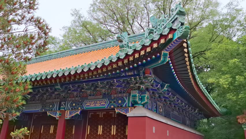 Traditional Chinese temple building features ornate roof tiles in the Summer Palace of Beijing China outdoors. ancient architecture, asian heritage, historic landmark, summer travel.
