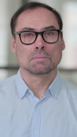Middle Aged Man showing Thumbs Down Gesture, Vertical Video