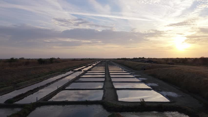 Aerial drone flight over the salt marshes of Ars-en-Ré at dawn, Ile de Ré, France