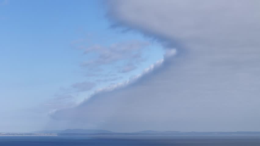 Aerial view of a dramatic cloud formation over the sea near the coast of Lisbon, Portugal.