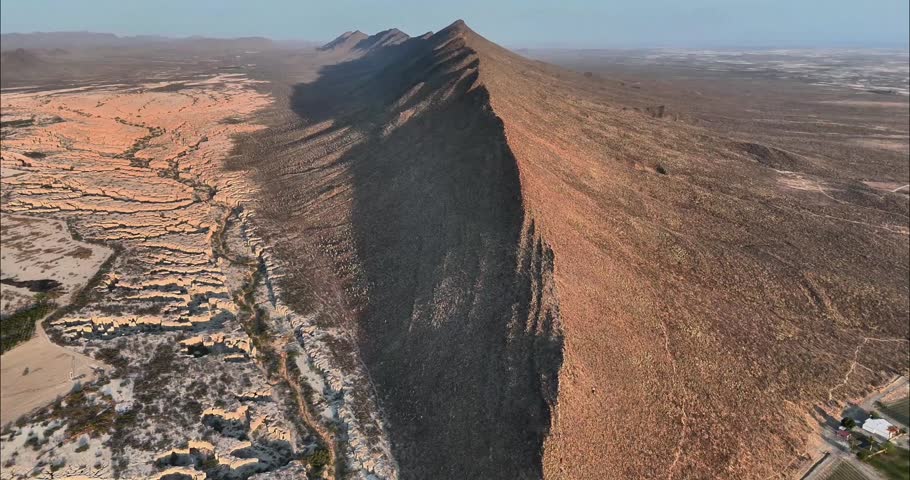 Aerial view of the rugged mountain ridge and desert landscape in Parras de la Fuente, Coahuila, Mexico.