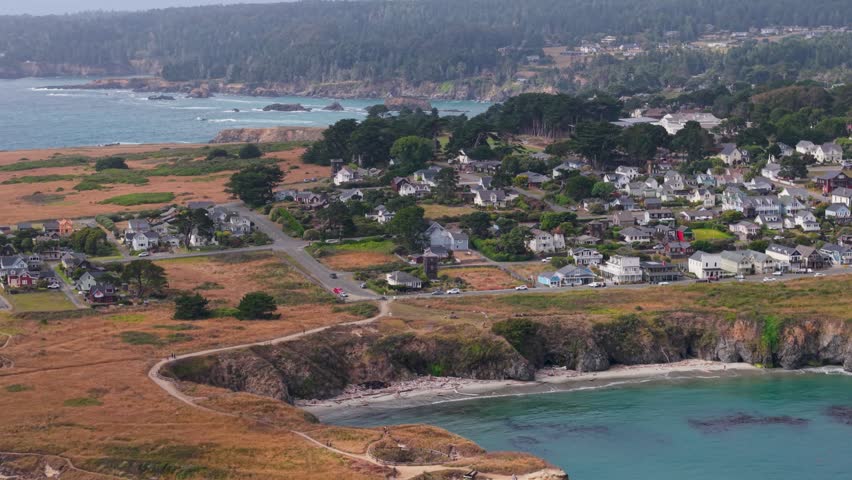 See the beautiful town of Mendocino in California with aerial views of the coastline and the music festival tent in the distance.