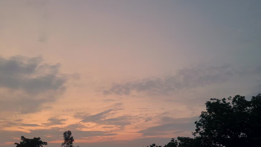 Serene dusk sky, clouds drift, birds fly, soft sunset colors, nature backdrop.