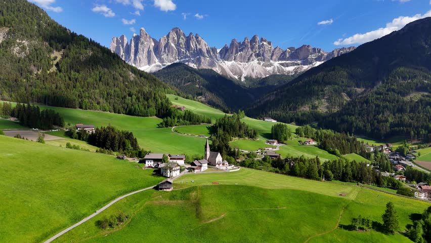 Aerial drone view of Santa Maddalena (Magdalena) village with the Dolomite mountains in the background. Val di Funes valley, Trentino-Alto Adige region. Italy, Europe.