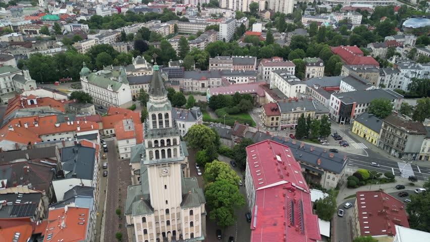 Bielsko-Biała, Poland 07 15 2026
High-quality aerial drone footage of the market square and city skyline. Market square, mountains, peaks, townhouses, church.