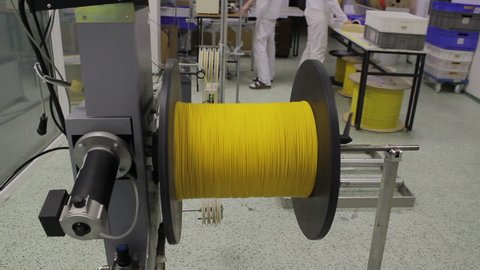 reel with fiber optic cable on winding machine