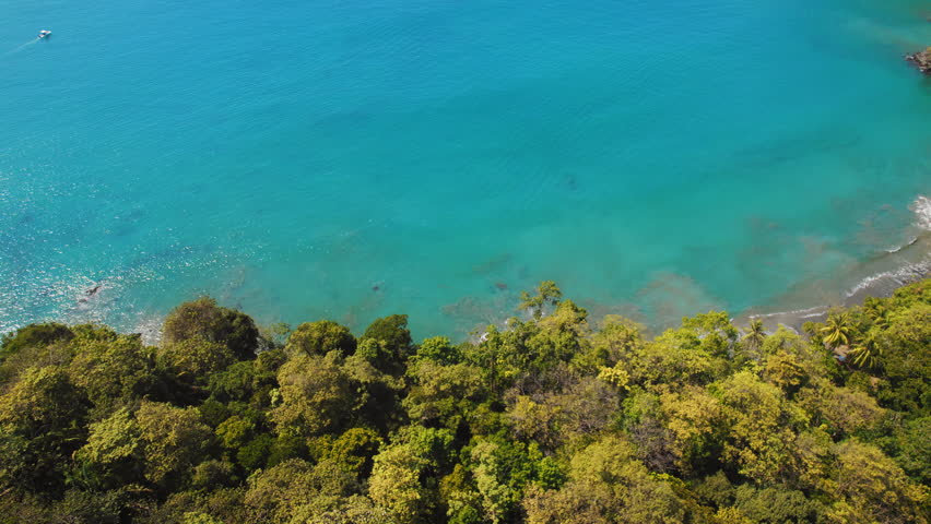 Quiet stretch of coastline with turquoise waters along sandy Beach in Costa Rica
