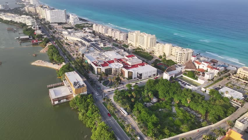 Aerial view of the hotel zone in Cancun with turquoise Caribbean sea, white sand beaches, and modern resorts along the coast in Cancun, Quintana Roo, Mexico.