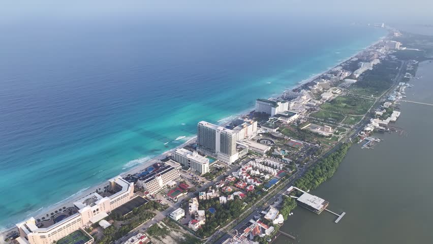 Aerial view of the hotel zone in Cancun with luxury resorts along the turquoise Caribbean Sea coastline in Cancun, Quintana Roo, Mexico.