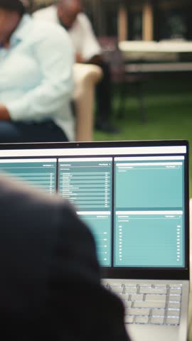 Vertical screen: Analytics dashboard appears on a laptop screen outdoors, with an employee checking data metrics for report planning, data analysis chart display and productivity in a modern.