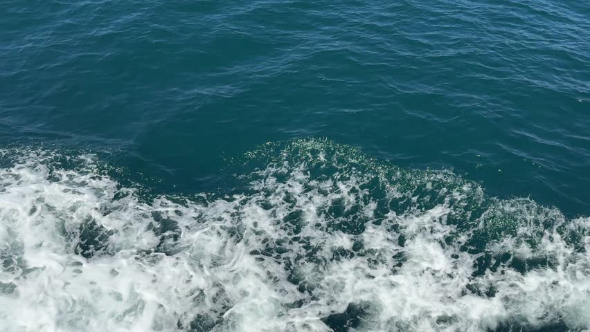 Ocean waves crashing against the shore in a filmstrip