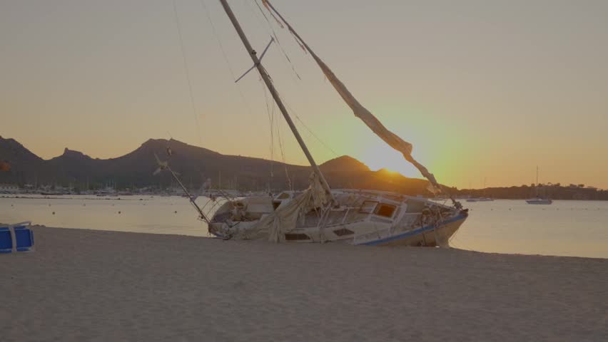 Wrecked yacht on the beach at golden hour, Puerto Pollensa