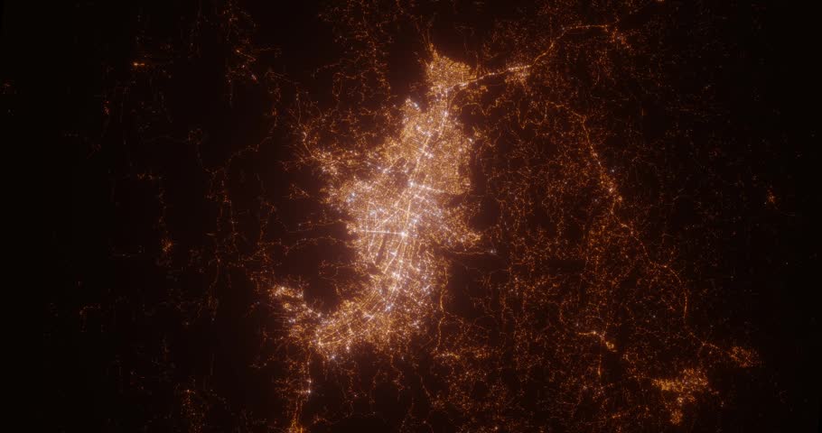 Medellin (Colombia) aerial view at night. Top view on city from space. Camera is zooming in, rotating clockwise