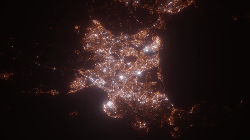 Cape Town (South Africa) top view at night. Top view on modern city with street lights and glow effect. Camera is zooming in, rotating clockwise. Vertical video. The north is on the left side