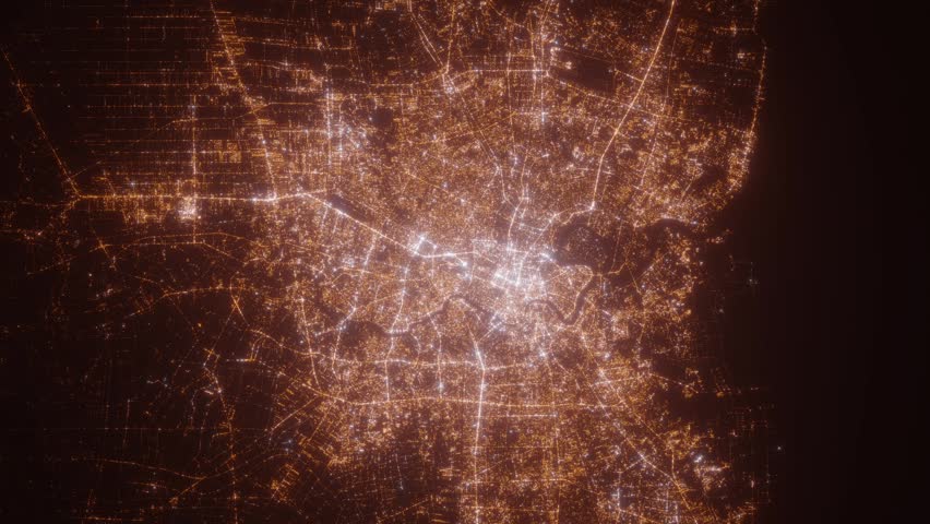 Bangkok (Thailand) top view at night. Aerial view on modern city with lights. Camera is flying above the city, moving backward. Vertical video. The north is on the left side