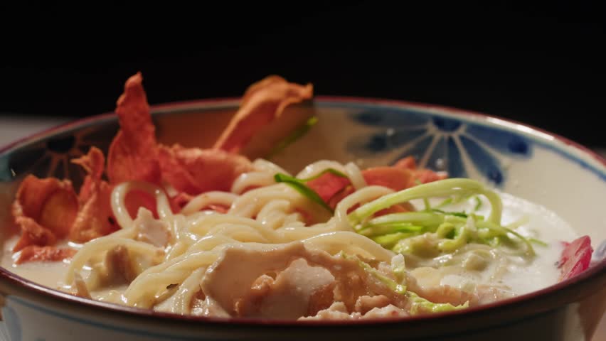 Japanese Ramen with Beef or chicken, rice noodles with fried meat, Tom Yam kung Spicy Thai asian soup, chef cooking in traditional korean chinese food. Close up of tasty vietnamese cuisine. 