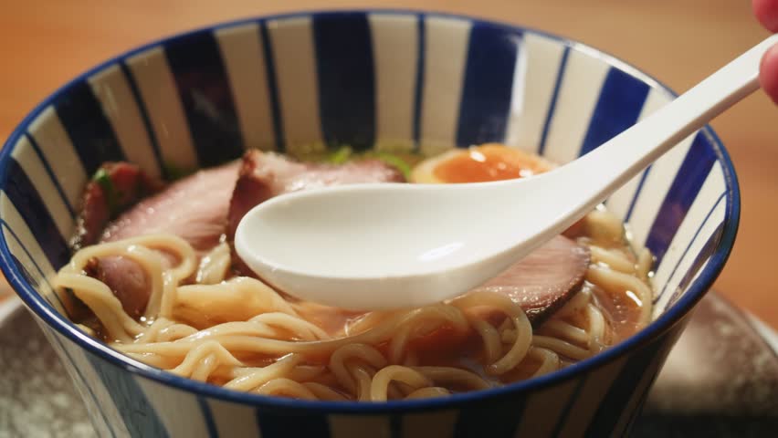 Japanese Ramen with Beef or chicken, rice noodles with fried meat, Tom Yam kung Spicy Thai asian soup, chef cooking in traditional korean chinese food. Close up of tasty vietnamese cuisine. 