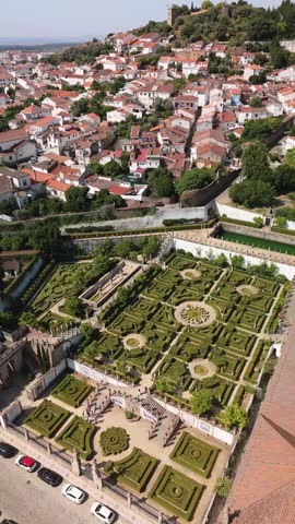 Aerial view of the formal gardens of the Episcopal Palace with intricate boxwood hedges and stone staircases in Castelo Branco, Portugal.