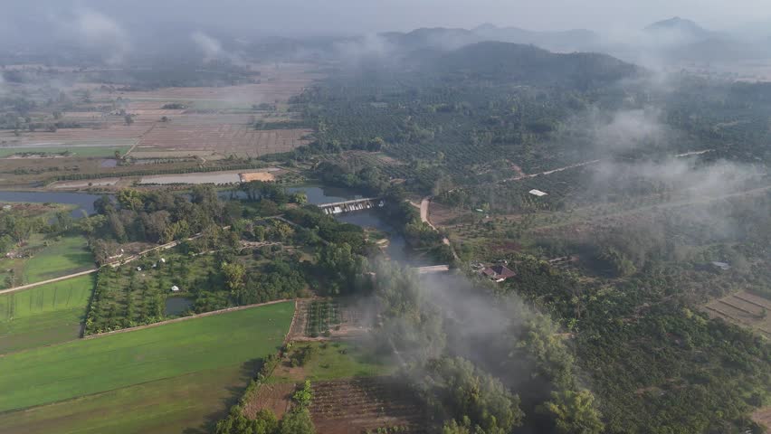 Aerial view of small spillway in Pa Daet district in Chiang Rai province of Thailand. Spillway, passage for surplus water over or around a dam when the reservoir itself is full.