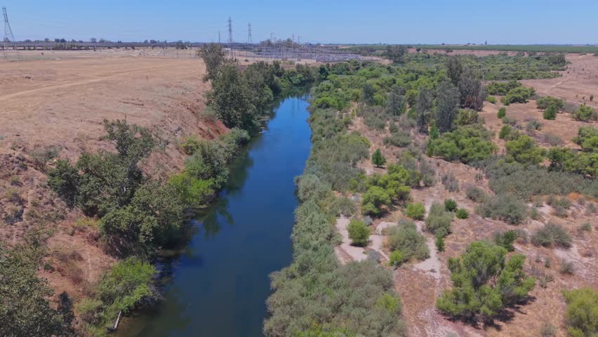 Orbiting aerial drone footage circling the San Joaquin River in California