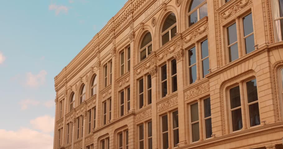 Close view of ornate historic commercial architecture in downtown Dubuque featuring decorative stone facades and classic American design.
