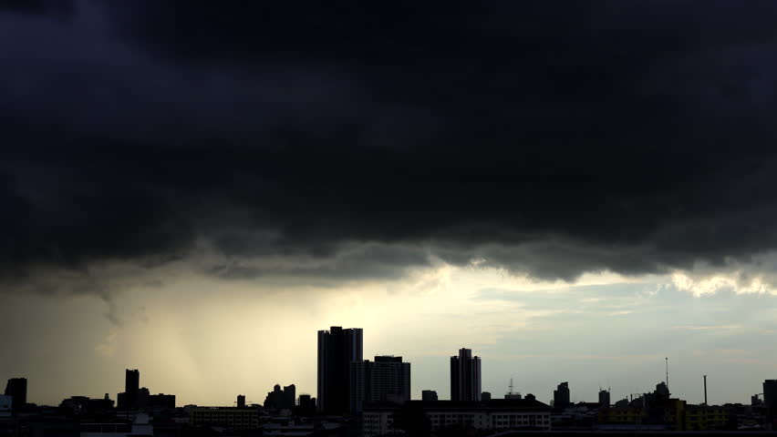 Dramatic timelapse of dark rain clouds sweeping across Bangkok, Thailand.