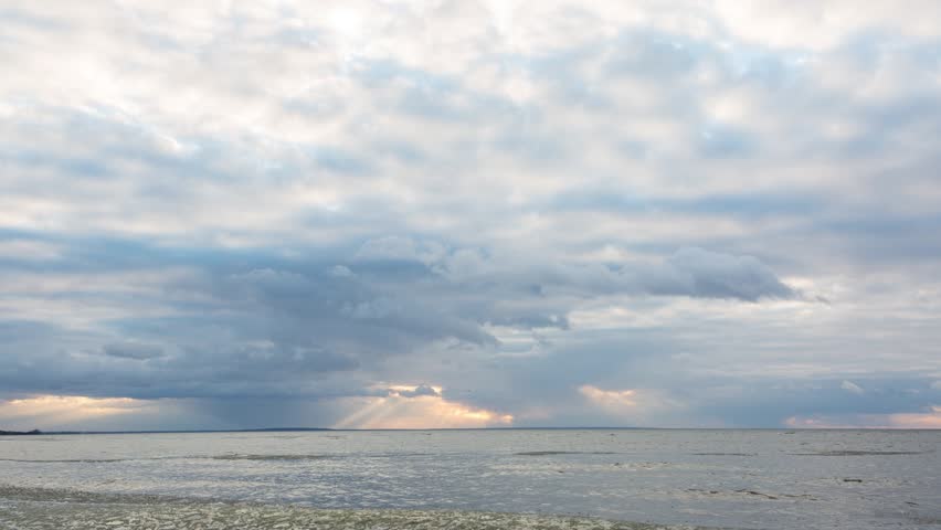 Timelapse of sunny sky with clouds in winter at sunset, beautiful sky over the river