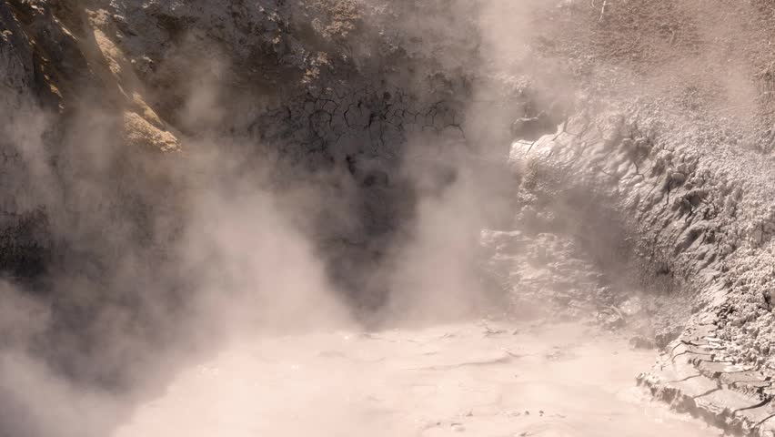 Steam Rising From Mud Volcano In Yellowstone National Park Wyoming